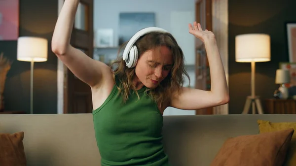 Excited Woman Dancing Indoors Sitting Sofa Happy Woman Enjoying Music — Stock Photo, Image