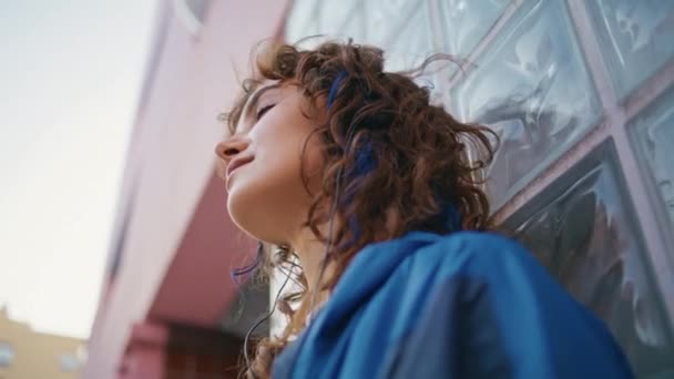 stock-video-positive-lady-enjoying-music-earphones