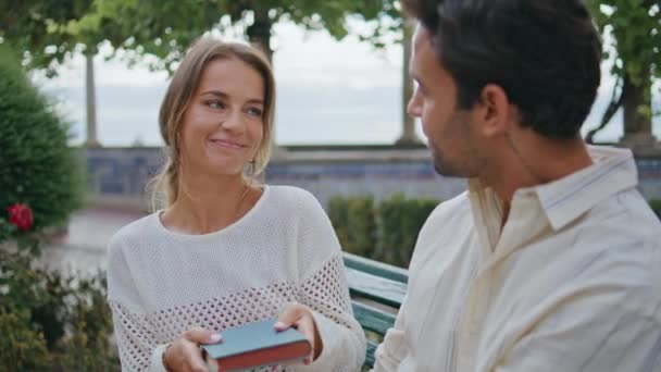 Cute Woman Giving Present Loving Boyfriend Seaside Bench Closeup Happy — Stock Video