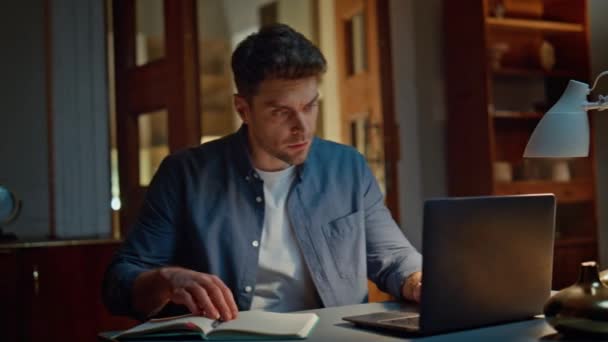 Focused Man Working Laptop Night Apartment Closeup Serious Guy Writing — Stock Video