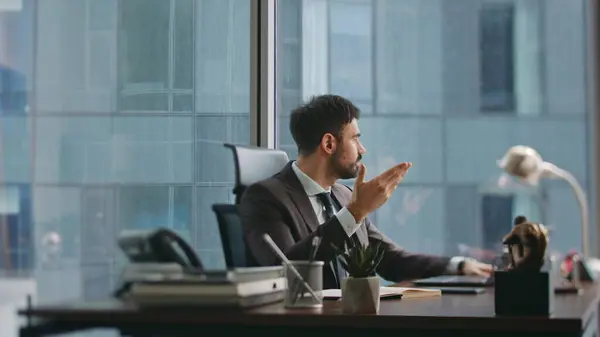 Business man frustrated by problem working at luxury office desk. Exhausted bearded company employee feeling stress from business trouble. Disappointed entrepreneur tired of job fail corporate crisis.