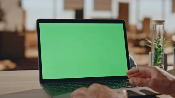 stock image Man hands videocalling chromakey computer at table closeup. Unknown director having video conference at green screen laptop office. Unrecognizable businessman talking online meeting at mockup device 