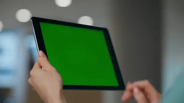Unknown employee having mockup device conversation in office closeup. Anonymous woman manager making chromakey online video call job interview. Unrecognizable boss waving hand to green screen computer