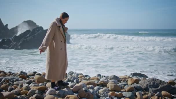 Carefree Girl Walking Seashore Stepping Beach Stones Ocean Waves Washing — Stock Video