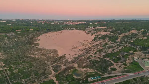 Aerial Landscape Sand Terrain Hues Twilight Cars Moving Serene Dunes Stockafbeelding