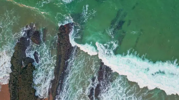 Aerial Perspective Waves Breaking Rocks Sand Green Ocean Waters Mix Stockfoto