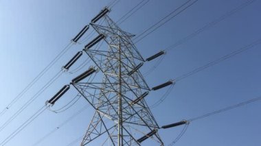 Electricity transmission towers with glowing wires