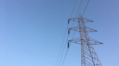 Electricity transmission towers with glowing wires