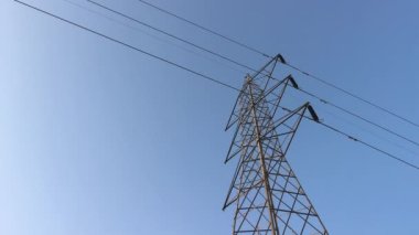 Electricity transmission towers with glowing wires