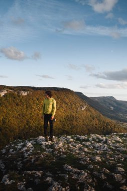 Youn man in the the mountains of Navarra, Spain in autumn clipart