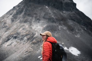 Hiker in Norway Majestic Mountain Backdrop clipart