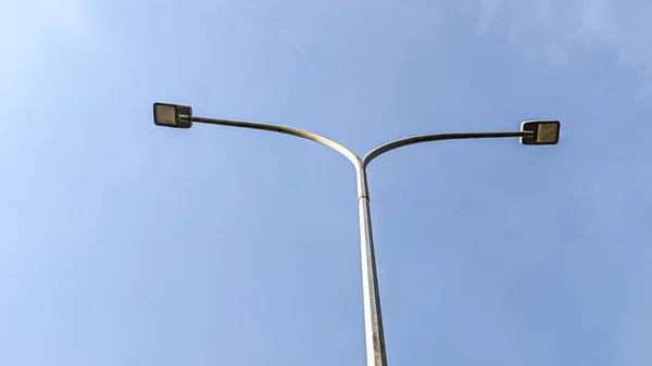 Low Angle View of LED Street Lamp post under clear blue sky