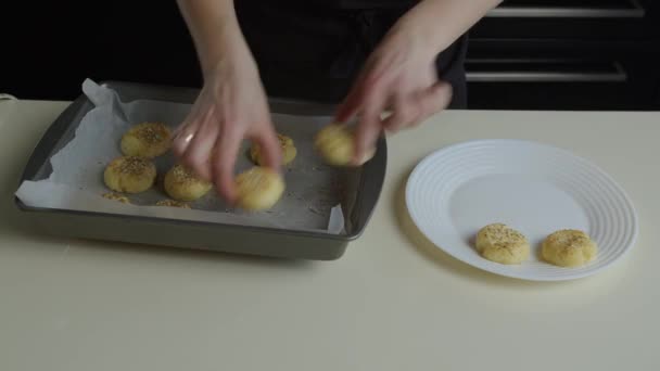 Womans Hands Carefully Transfer Small Hot Salty Cookies Parchment Lined — Stock Video