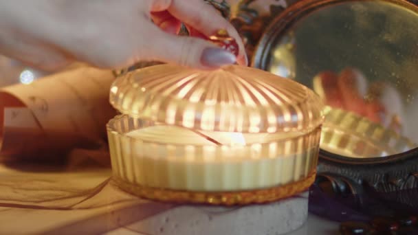 Womans Hand Covers Burning Candle Crystal Shaped Ribbed Lid Vintage — Stockvideo