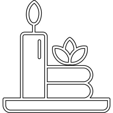 Kitaplı ve çiçekli mum