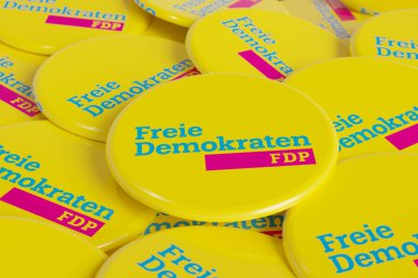 FDP - Free Democratic Party. Politics, campaign button on the table. FDP, free democratic party, part of the german government, liberal party. clipart