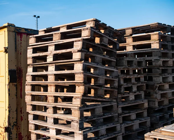 Stack of euro pallets at a freight yard. Transportation and logistics of goods. Transportation and logistics of various goods in Frankfurt am Main