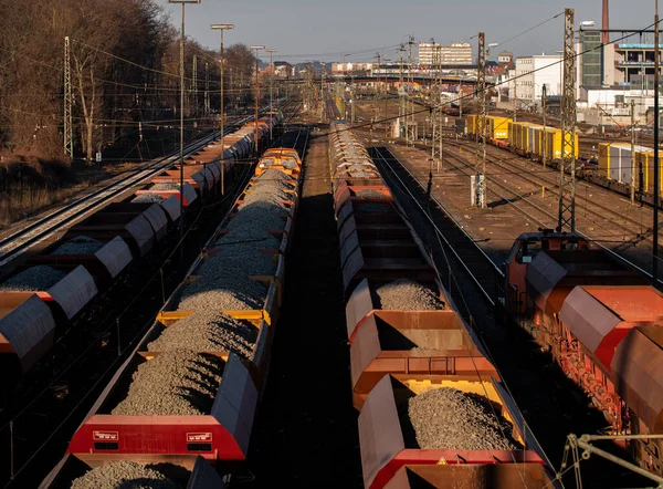 Railroad wagons, freight cars. Freight station, rails and wagons with stones, coal and gravel bulk cargo. Transportation and logistics of various goods in Frankfurt am Main