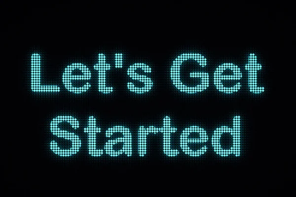 Let\'s Get Started, the text is displayed on a LED screen. The text \