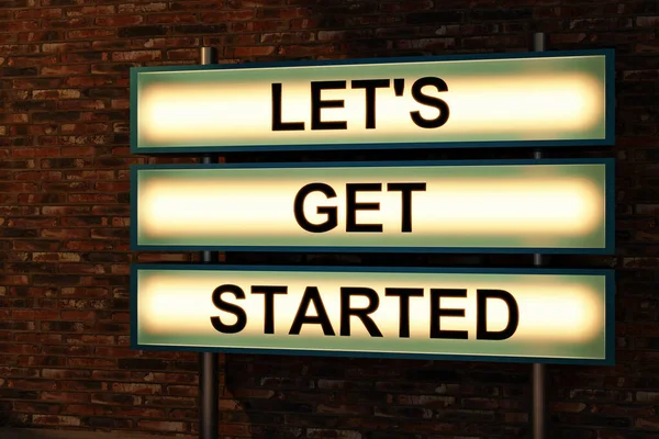 Let\'s get started. Black letters on a light box. The illuminated sign placed in front of a brick wall. Motivation, encouragement and inspiration concept.