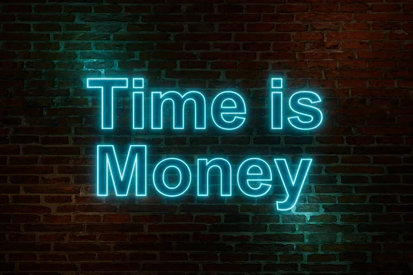 Time is Money. Brick wall at night with the text 