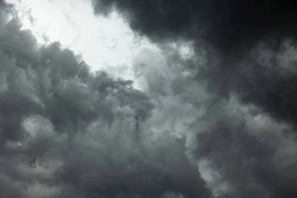 stock image Dramatic overcast sky with dark clouds during summer. Bad weather front with strong wind and rain.