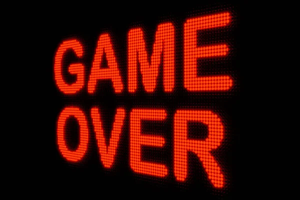 Game Over, close-up led sign. Dark screen with the text \