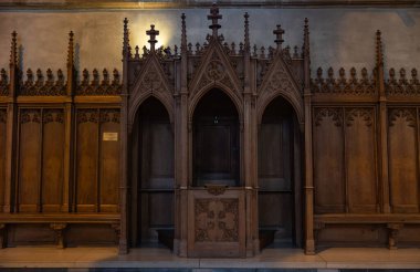 Confessional in the church, Cathdrale NotreDame in Luxembourg. Historic church built in the years 1631 - 1621. Resting place of John the Blind, King of Bohemia and Count of Luxembourg. clipart