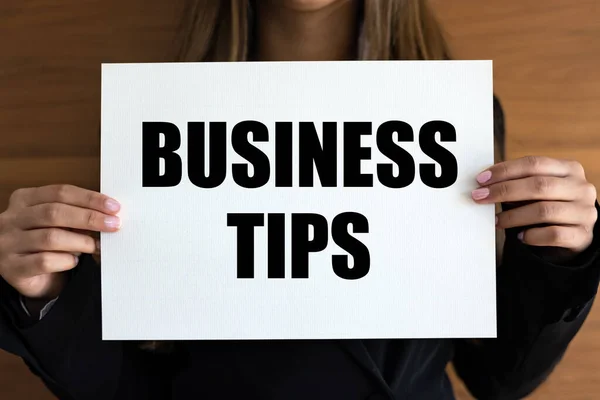 Business tips. Woman with white page, black letters. Advice, hint, strategy, guidelines.