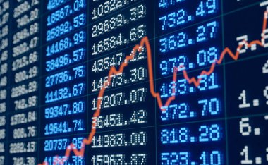 Report, statistic or corporate information. Changing numbers, financial figures, business data. Orange chart reflection in the screen.
