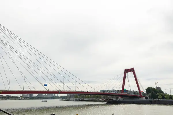 stock image Rotterdam, Netherlands - July 9, 2004: Part of the Willems bridge in Rotterdam, spanning the Nieuwe Maas. Cloudy day at  the afternoon.