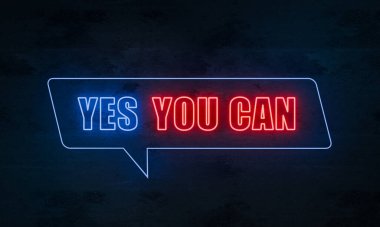 Evet, yapabilirsin. Koyu beton bir duvarda mavi ve kırmızı ışıklı neon tabela. İlham, motivasyon, tavsiye, öz disiplin, şans..