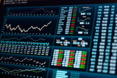 Close up business data on a notebook screen. Stock market trading  information, chart, graph and index data.  clipart