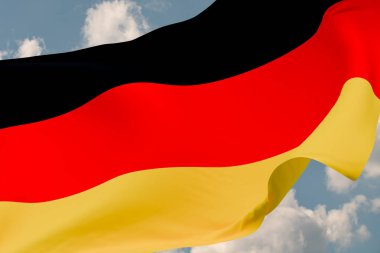 Almanya 'nın bayrağını dalgalandırın. Arka planda bulutlar olan mavi gökyüzü. Seyahat, turizm, seyahat, ülke, tur, tatil, tatil, varış, tatil. 3B illüstrasyon