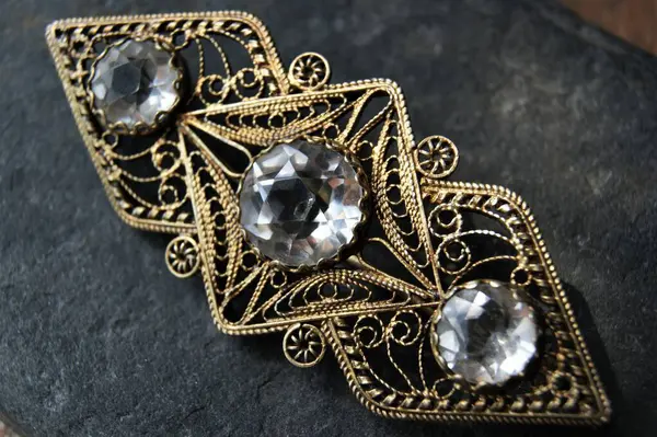 Vintage brooch with precious stones. Jewelry and jeweler\'s product.