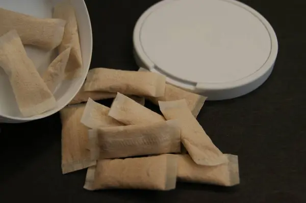 stock image Packaging and nicotine pads on a dark background. 