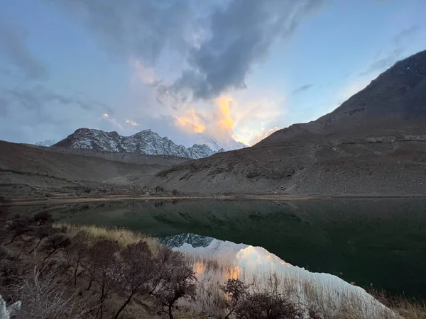 stock image beautiful sunrise with lake and mountains