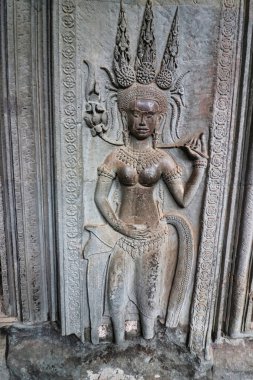 Apsara - Tanrıların saraylarında ilahi perileri ve ilahi dansçıları tasvir eden, Angkor Wat 'ta taşa oyulmuş Siem Reap, Kamboçya, Asya