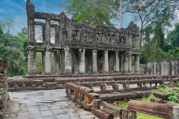 Ruined multi level walls and pillars in the outer courtyard of Preah Khan temple at Siem Reap, Cambodia, Asia