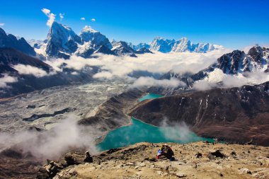 The largest glacier in Nepal - Ngozumpa glacier, Cholatse, Taboche with the two Gokyo lakes is visible in this stunning panorama from the top of 5350 m high Gokyo Ri in Nepal clipart