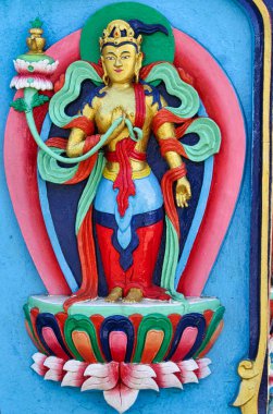 Divine Buddhist god painted sculpture in the Tengboche Monastery,Nepal clipart