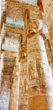 The Great Hypostyle hall with 18 columns topped by four-faced carvings of Hathor with intricate art in the Temple of Hathor at Dendera from the Ptolemaic era between Luxor and Abydos towns,Egypt clipart