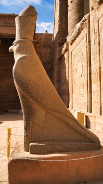 Close up of granite statue of Horus, the Falcon god, son of Isis and Osiris and presiding deity  in the Temple of Horus at Edfu built during the Ptolemaic era between 237 to 57 BC near Aswan,Egypt clipart
