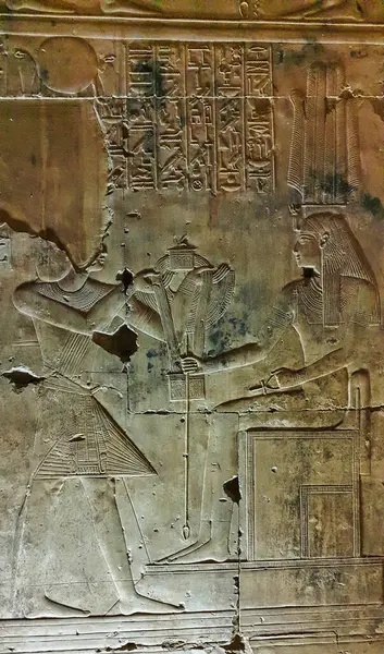 stock image Wall relief in the Chapel of Isis shows King Seti offering  a necklace to Goddess Isis in the Temple of Seti built in 13th century BC by the Pharoah Seti I near Abydos,Egypt