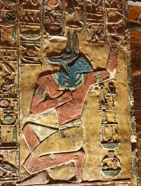 Painted wall relief of Jackal headed Anubis, God of Embalming in Burial Chamber J in the Tomb of Seti I, KV17 at the Theban necropolis in the Valley of Kings in Luxor,Egypt clipart
