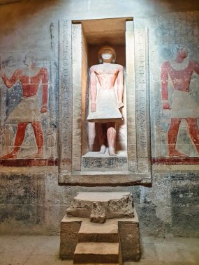 Statue of Merurka standing in a wall niche, a powerful official around 2300 BC inside the mastaba Tomb of Merurka,Grand Vizier to Pharoah Teti,6th dynasty in Saqqara,Cairo,Egypt clipart