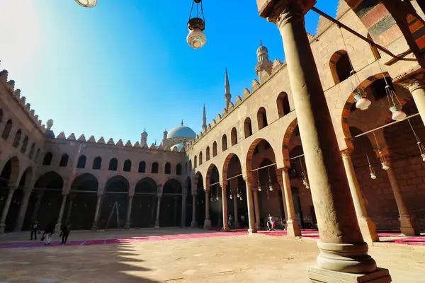 stock image View of the courtyard of the Al Nasir Muhammad Mosque with the minarets of the Muhammed Ali mosque visible in the background at the Citadel of Saladin in Islamic Cairo,Egypt