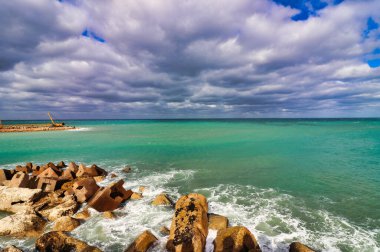 Sea erosion prevention concrete blocks line the outer walls facing the Mediterranean at the Citadel of Qaitbay,built by the Mamluk Sultan Qaitbay in 1479 AD,Pharos Island,Alexandria,Egypt clipart