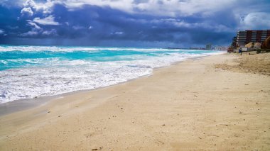 Playa Delfines beach in Cancun with powdery silver sands and Turquoise blue waters of the caribbean sea,during the October hurricane season in the Hotel Zone of Cancun,Quintana Roo,Mexico clipart