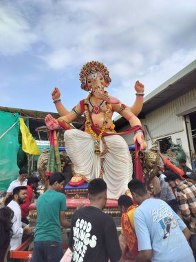 Burhanpur, Madhya Pradesh - September 07, 2024: people celebrating Ganesh festival in india. Hindu's god ganesha blessings on this 10 days. People worship of Hindu god on occasion of Ganesh utsav.  clipart